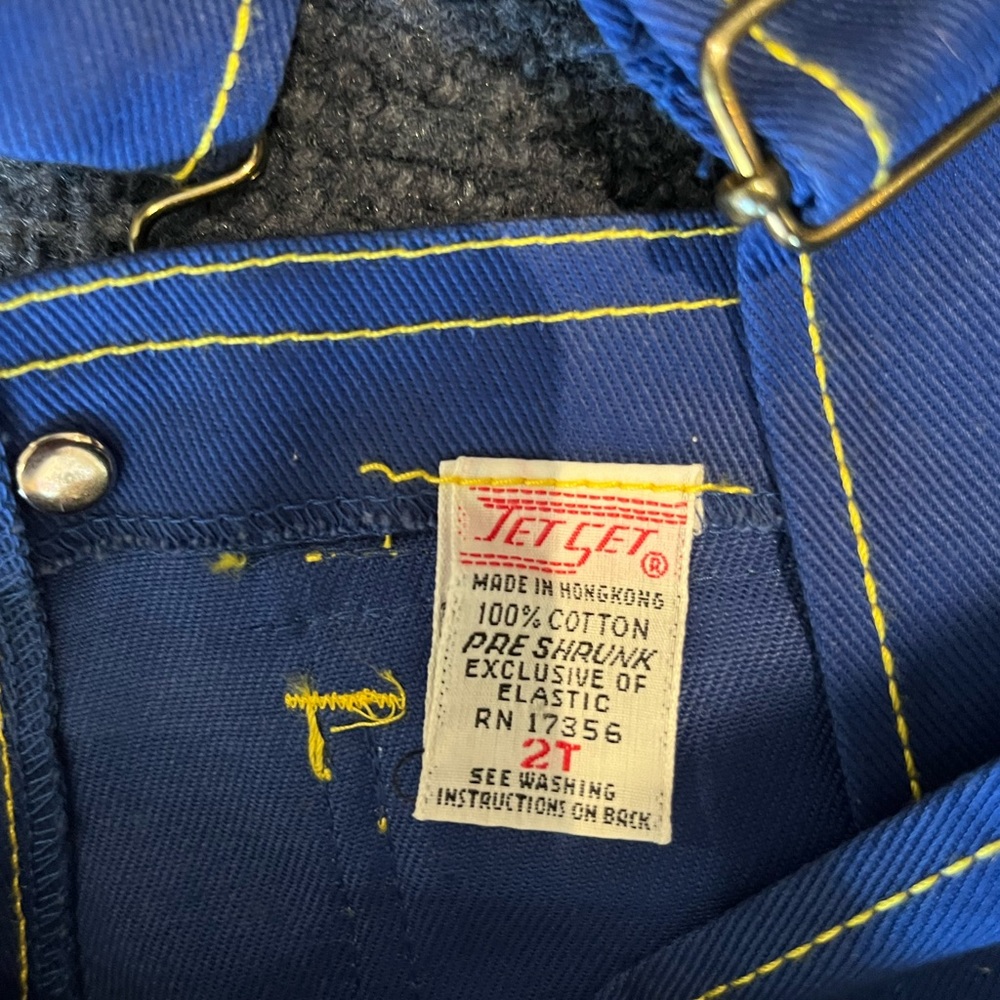 Blue overalls with yellow detail